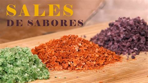 Fotografía de diversos frascos de sales aromatizadas (romero, trufa, merkén) mostrando sus distintas texturas y colores