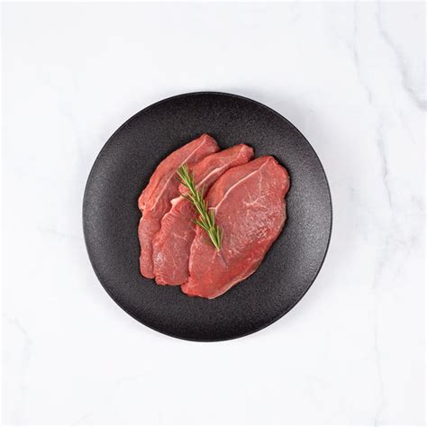 Bistec de posta rosada a la plancha con un término medio