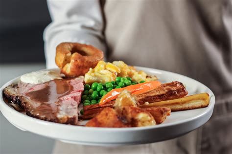 Ilustración de una mesa tradicional británica con un Sunday Roast