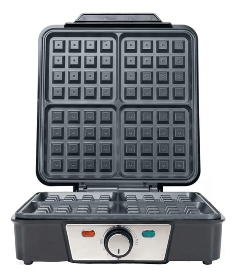 Foto de una waflera eléctrica en uso cocinando un waffle.