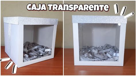 Fotografía de un cupcake perfectamente decorado dentro de una caja individual con ventana de acetato y adornos artesanales