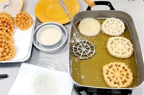 Esquema de la elaboración de los buñuelos de viento: preparación de la masa, fritura y relleno final