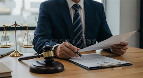 Thematic photo of legal documents and scales of justice, or a lawyer reviewing contracts
