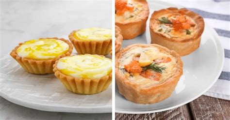Imagen de una variedad de tartaletas decoradas con distintos ingredientes dispuestos en una mesa festiva.