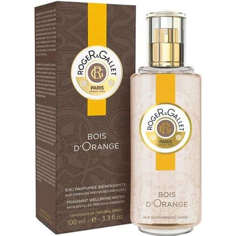 Frasco de perfume Bois d'Orange con naranjas
