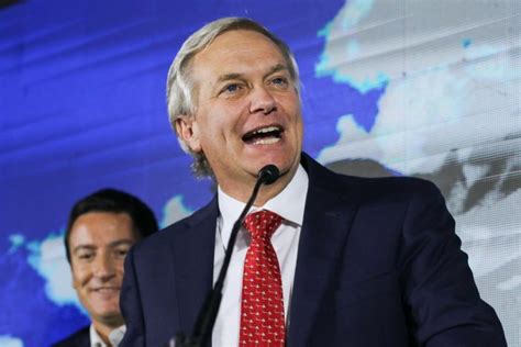 Christian Kast en un entorno empresarial o con el logo de Bavaria