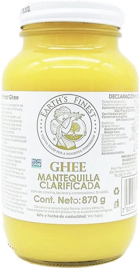 Tarro de ghee (mantequilla clarificada) en un cuenco