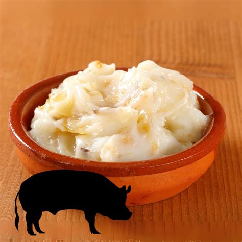 Ilustración histórica mostrando el uso de manteca de cerdo en la cocina del siglo XIX.