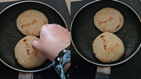 Arepas dorándose en una sartén