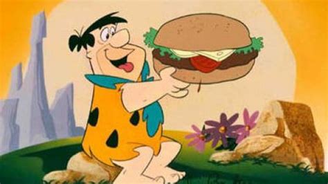 Ilustración de Pedro Picapiedra comiendo una enorme costilla de brontosaurio