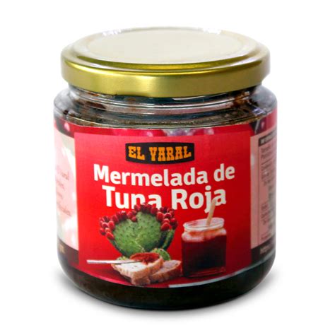 Fotografía de un frasco de mermelada de tuna casera con frutas frescas al lado.