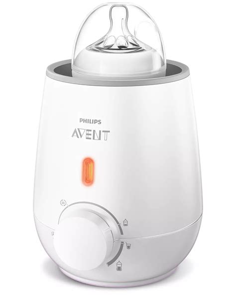 Calentador de biberones portátil Philips Avent en uso, mostrando su tamaño compacto