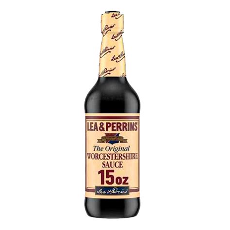 Botella de salsa inglesa (Worcestershire sauce) con un fondo de ingredientes que la componen (vinagre, anchoas, tamarindo, especias).