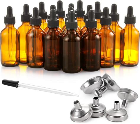 fotografía de botellas de vidrio oscuro para almacenar aceites esenciales