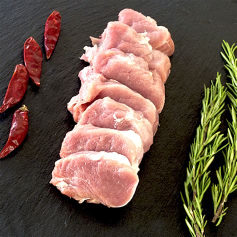 Foto de solomillo de cerdo crudo en medallones