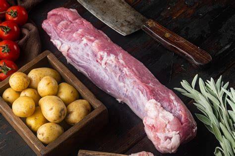 Foto de un lomo de cerdo entero preparado para asar.