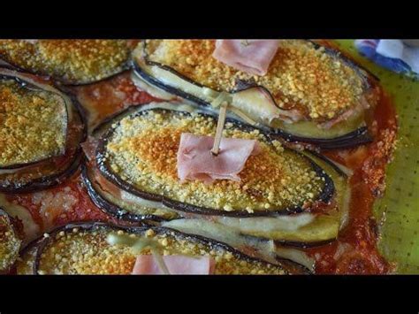 Láminas de berenjena marinadas y rellenas de jamón y queso