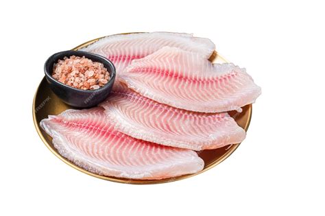 Foto de filetes de tilapia fresca en un plato, listos para cocinar
