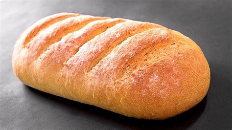 Foto de pan ciabatta recién horneado con corteza crujiente y miga alveolada