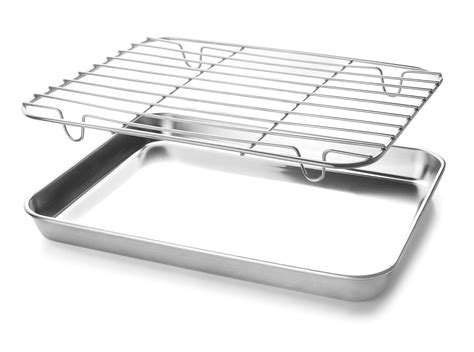 Esquema de las posiciones de la rejilla y la bandeja para cocinar con grill, mostrando la bandeja inferior para la grasa