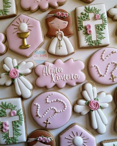 Variedad de galletas decoradas con motivos de bebé para niña