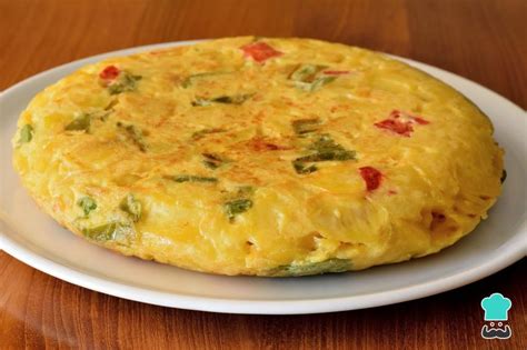 Tortilla de patatas con pimientos confitados