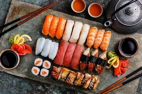 Photo of sushi served in glasses, layered with ingredients