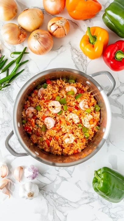 Thematic photo of jambalaya in a pot, with ingredients around it