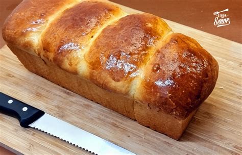 Esquema visual que muestra cómo el pan brioche es prensado y sellado, manteniendo todos los ingredientes en el interior sin que se desborden.