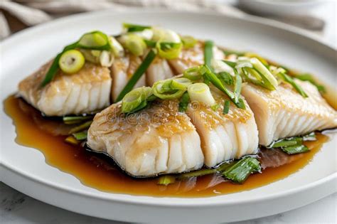 Plato de pescado al vapor con cebollín y jengibre, parte de la oferta de FoodLays.