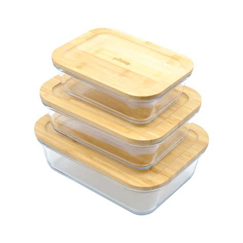 Comparativa de diferentes materiales de tuppers: vidrio, plástico, bambú y acero inoxidable.