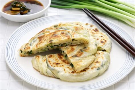 Variedad de panqueques chinos mostrando Cong You Bing, panqueques para Pato Pekín y Jianbing