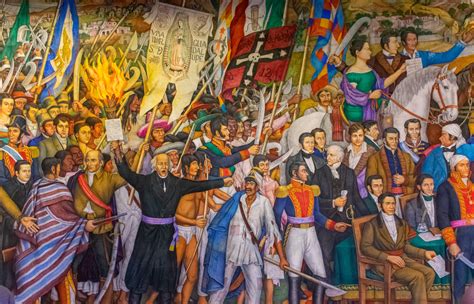 Fotografía de un mural histórico en la entrada de La Taberna, con retratos de periodistas.