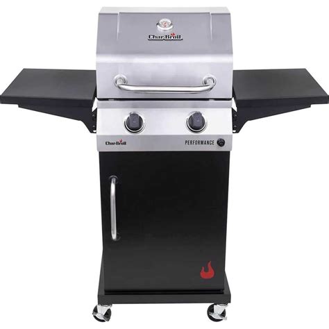 Estantes laterales metálicos de una parrilla de gas Char-Broil Classic de 2 quemadores, mostrando espacio para utensilios y platos.